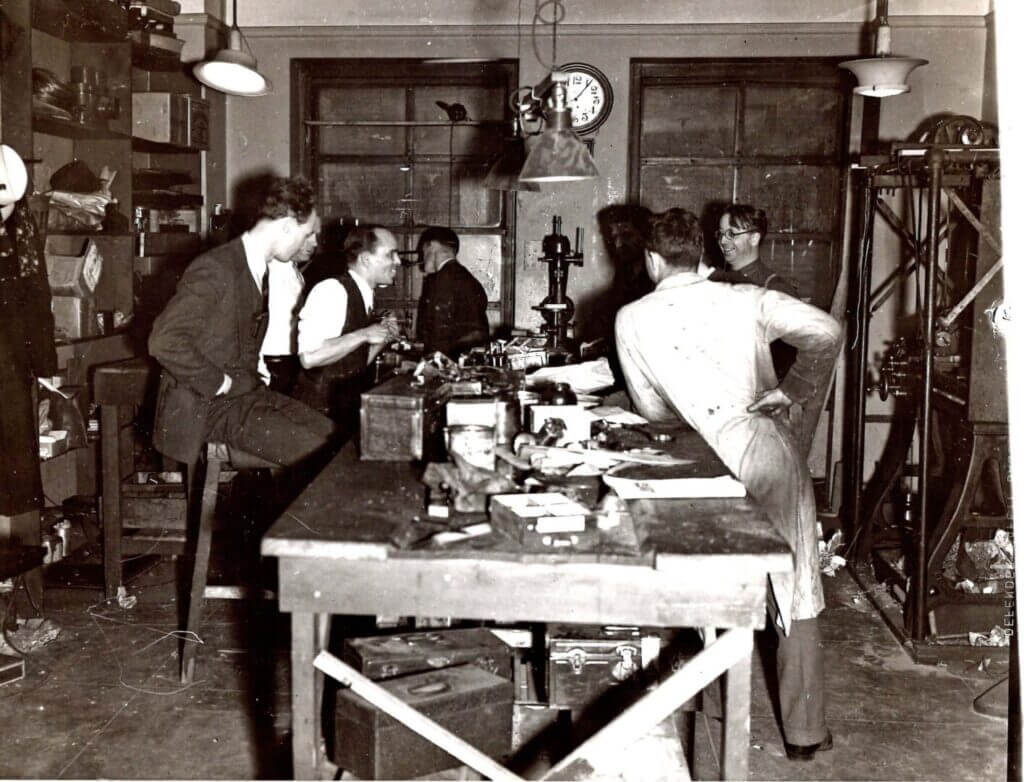 Men working in a model shop, historic photo